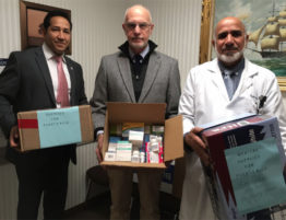 Photo of State Rep. Carlos Gonzalez, D-Springfield, Dr. Martin Pion and Dr. Mohammad S. Bajwa hold medications that will be shipped to Puerto Rico this month to help an emergency clinic on the island.